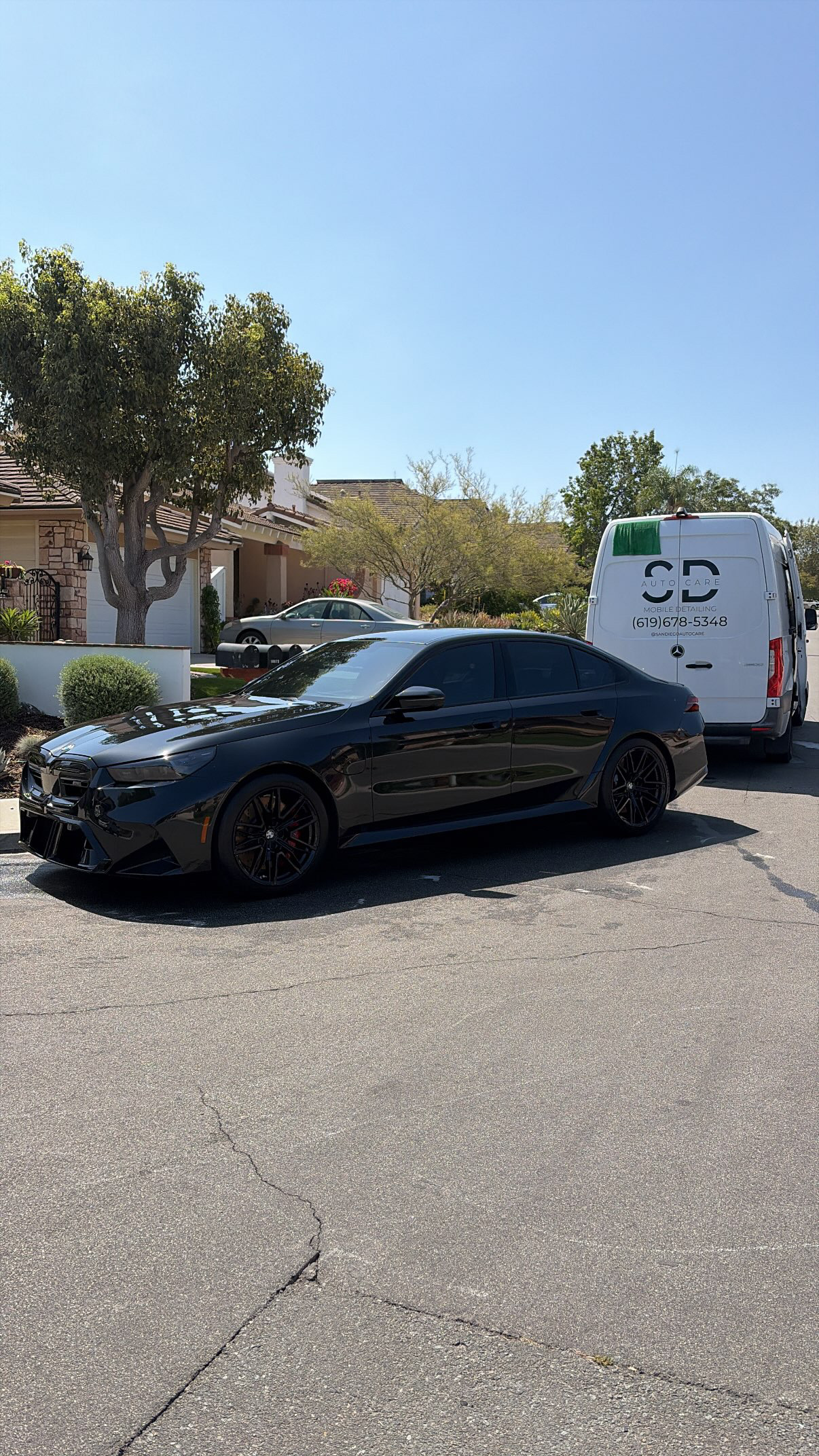 Black sedan finished after a maintenance detail