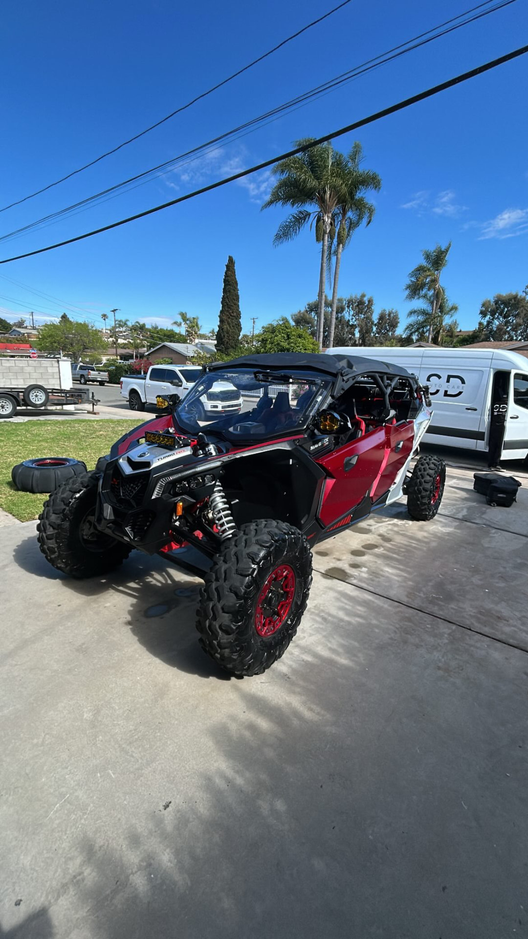 Red Can-Am Maverick X3 after a wash