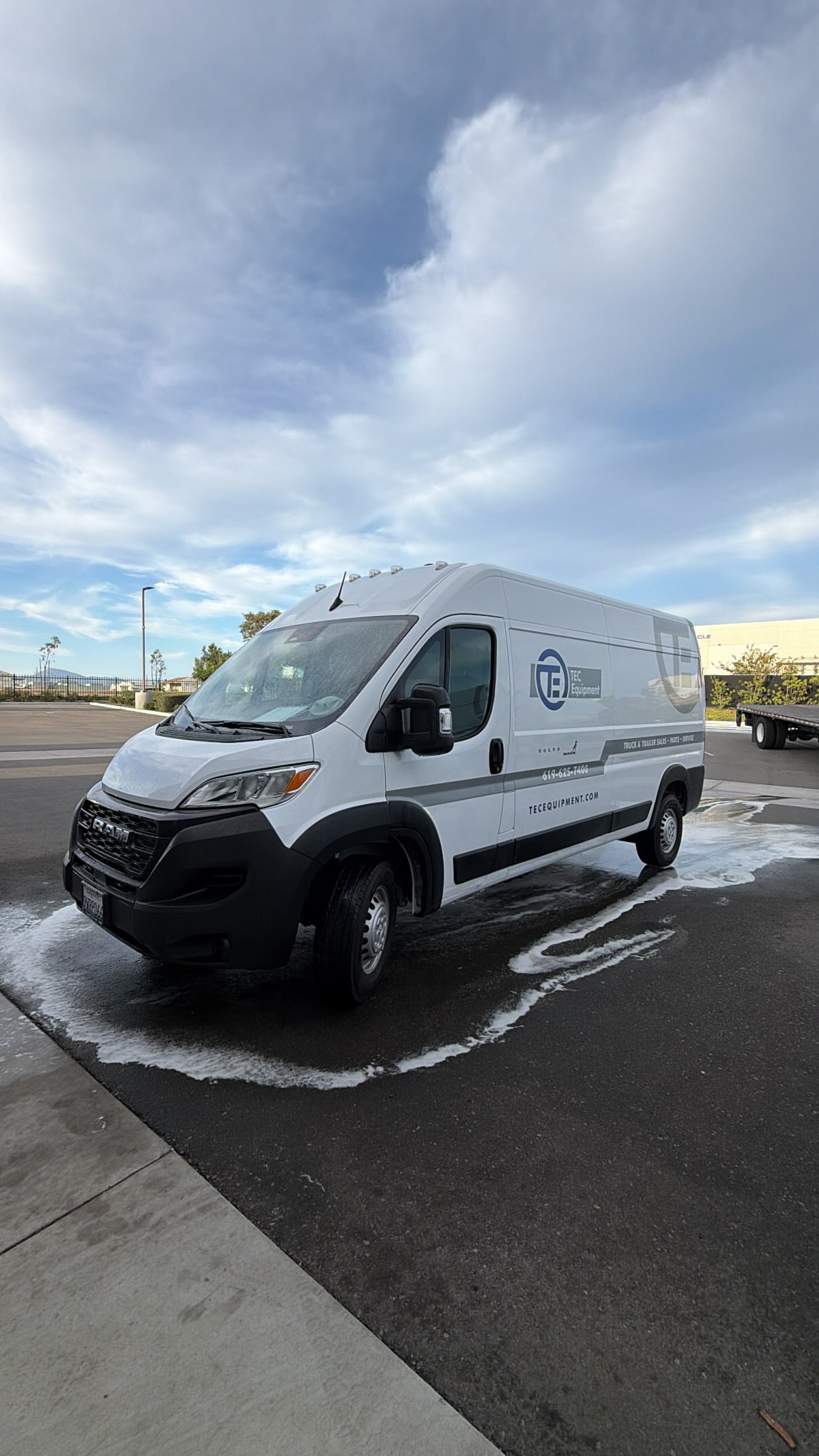 Commercial fleet van covered in wash foam