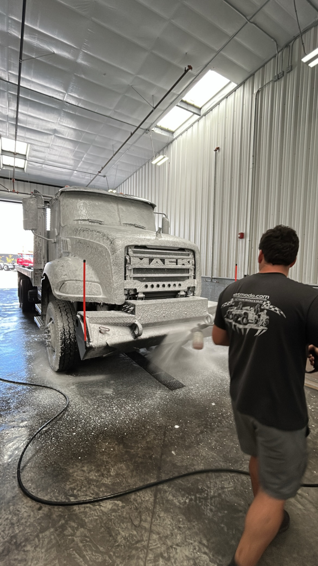 Mack flatbed in the wash bay