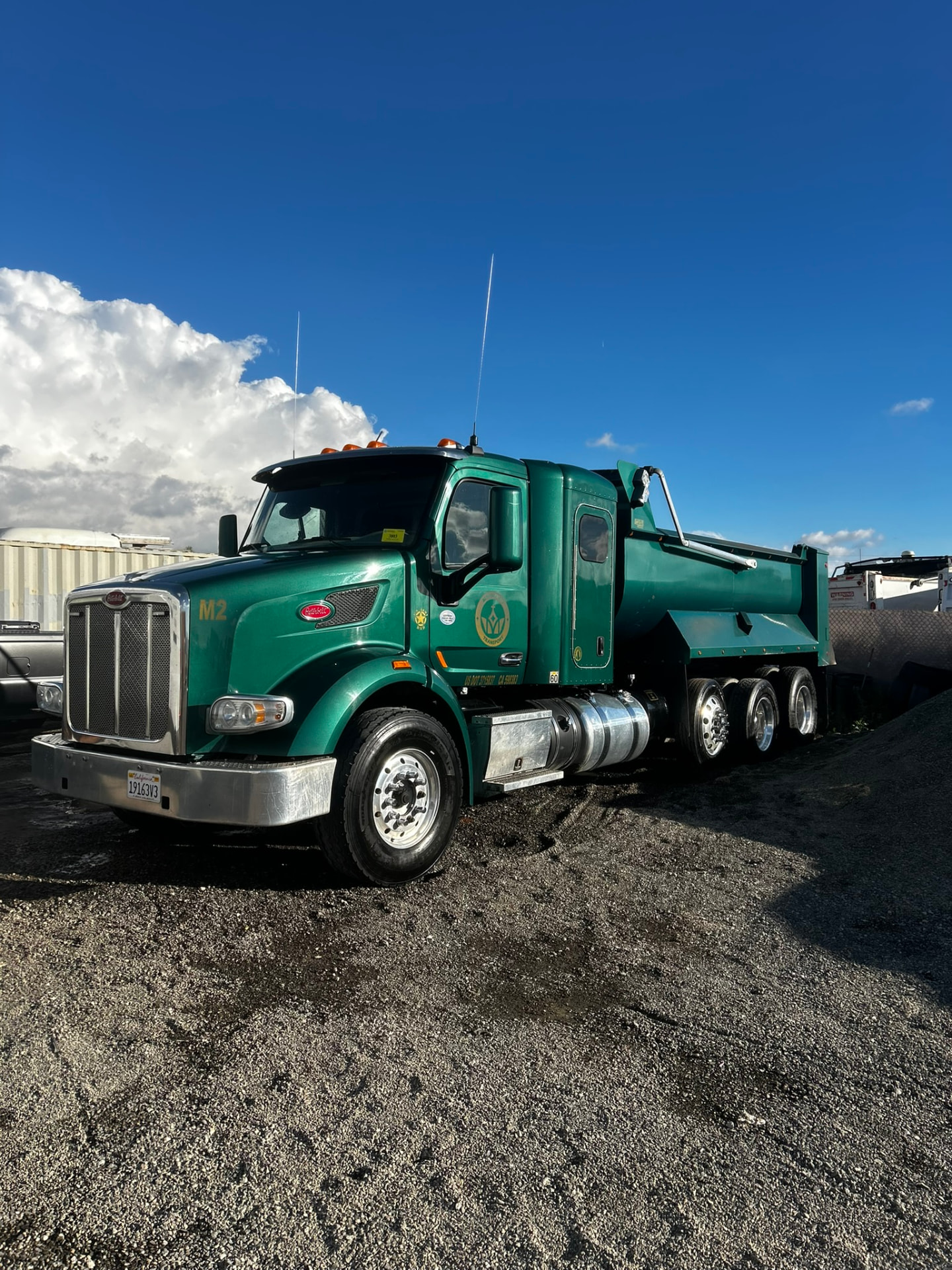 Green Peterbilt dump truck